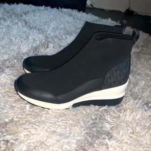Black and white Michael Kors sneaker boot